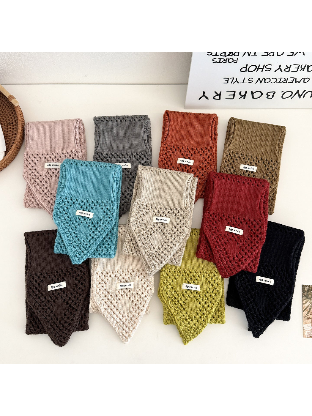Pull-through scarves in eleven colors displayed together