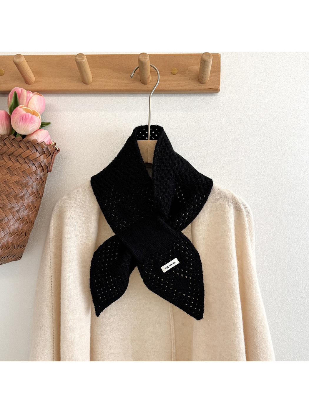 Deep Black pull-through scarf styled over a cream cardigan
