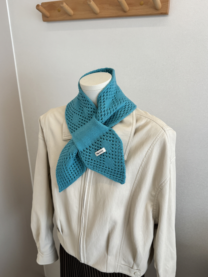 Lake Blue pull-through scarf styled on a mannequin with a cream jacket