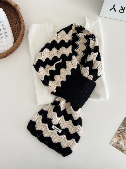 Black and white wavy knit pull-through scarf displayed flat
