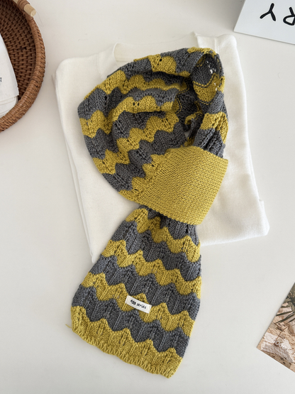 Gray and yellow wavy knit pull-through scarf displayed flat