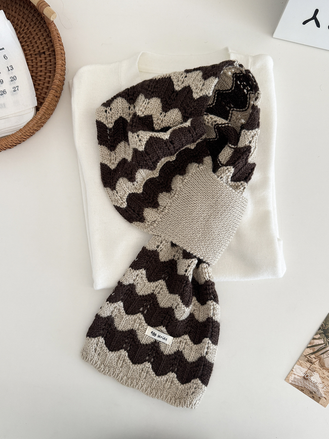Khaki and brown wavy knit pull-through scarf displayed flat