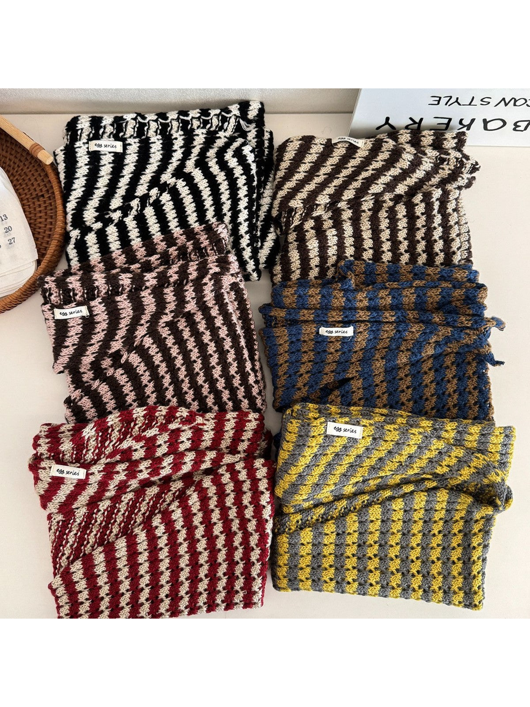 Multiple striped triangle scarf colors folded together