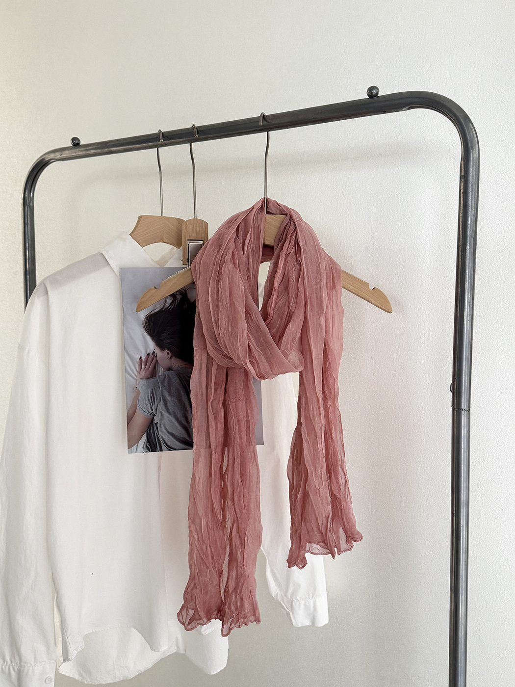 Dusty Pink crinkled scarf draped on a hanger