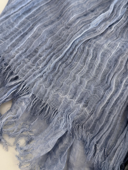 Close-up of Gray Blue scarf with crinkled texture and fringed edges