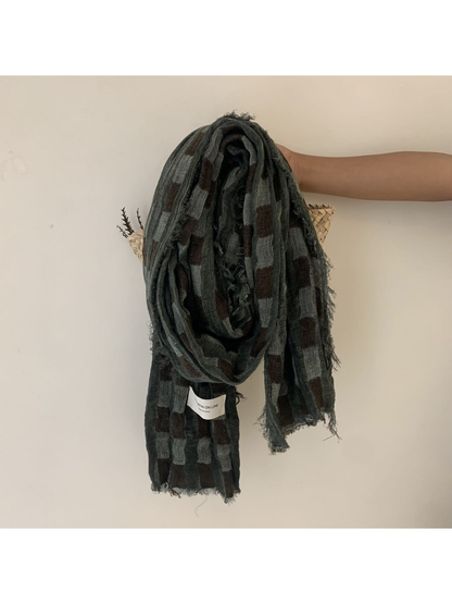 Dark Green checked scarf with an open weave and fringed edges