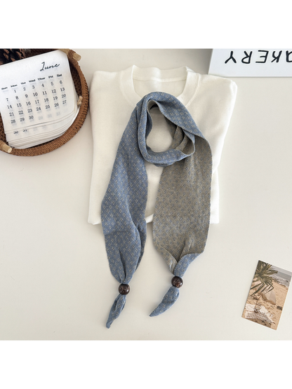 Blue geometric-patterned narrow scarf with bead accents