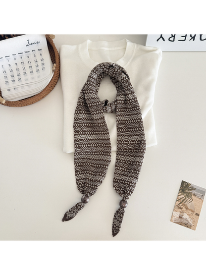 Coffee / Beige geometric-pattern narrow scarf with bead accents, flat display