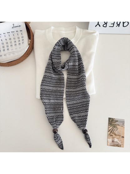Gray / Black geometric-pattern narrow scarf with bead accents, flat display