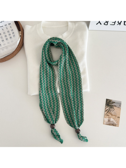 Green / Greige narrow patterned scarf with dark round end beads