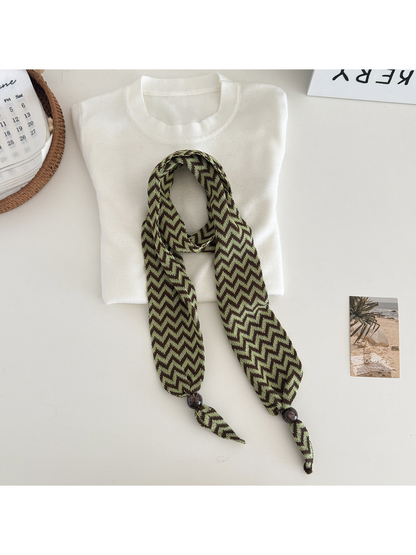 Green zigzag scarf with bead-accented pointed ends