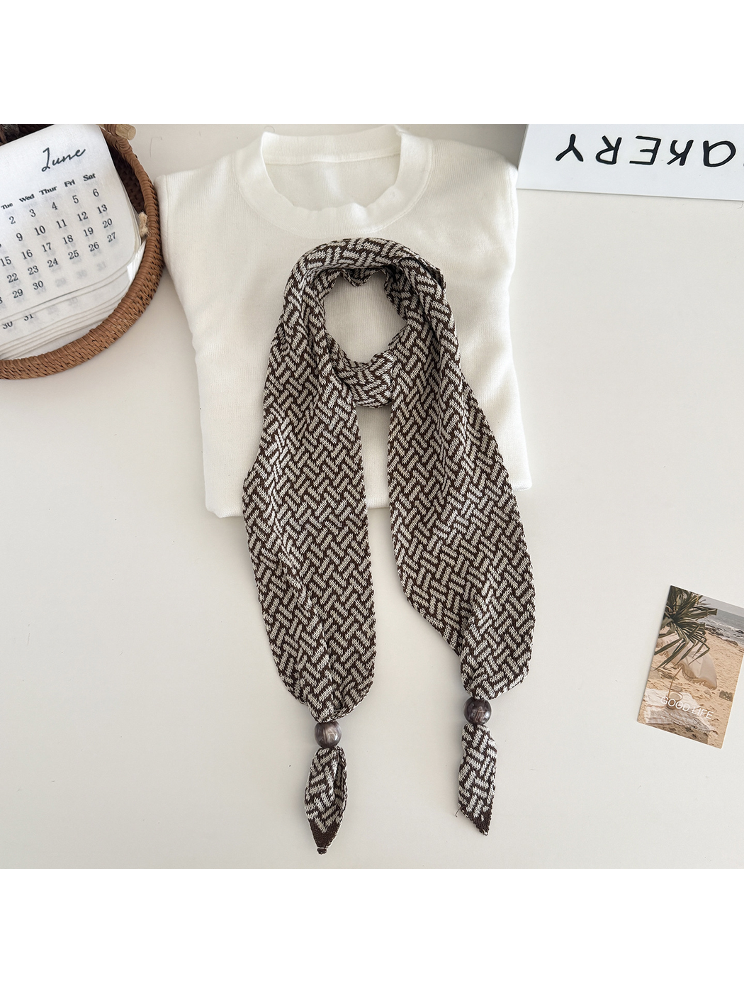 Beige Brown geometric narrow scarf with beaded pointed ends, flat lay