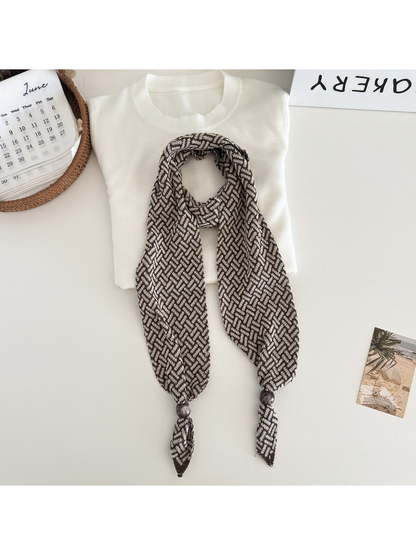 Beige Brown geometric narrow scarf with beaded pointed ends, flat lay