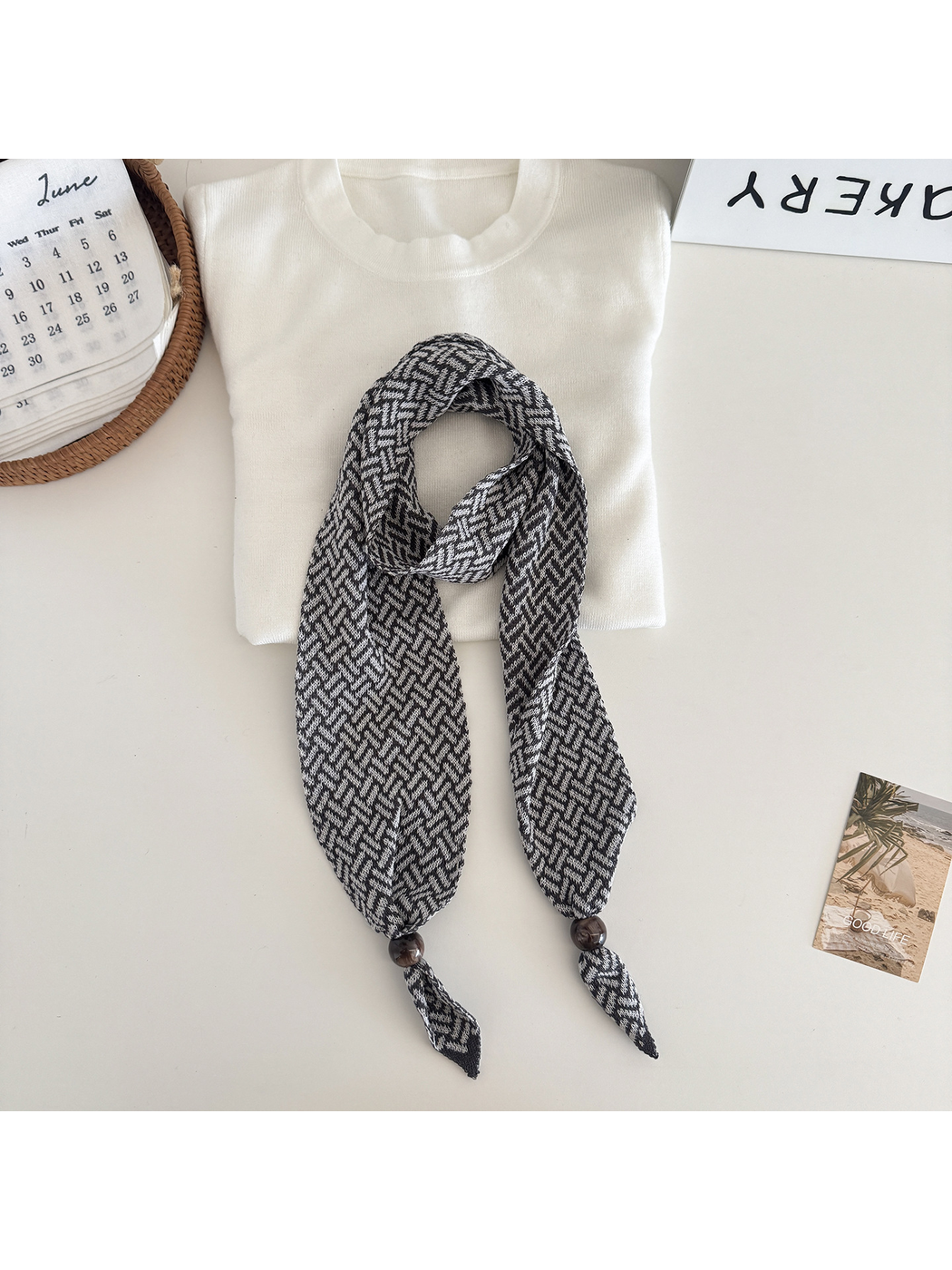 Gray Black geometric narrow scarf with beaded pointed ends, flat lay