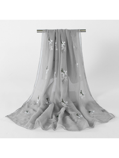 Gray sheer scarf with scattered white floral embroidery, draped view