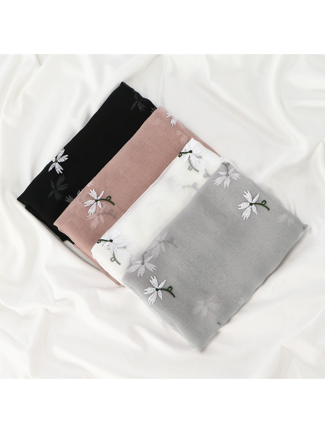 Black, Dusty Pink, White and Gray floral scarves folded together