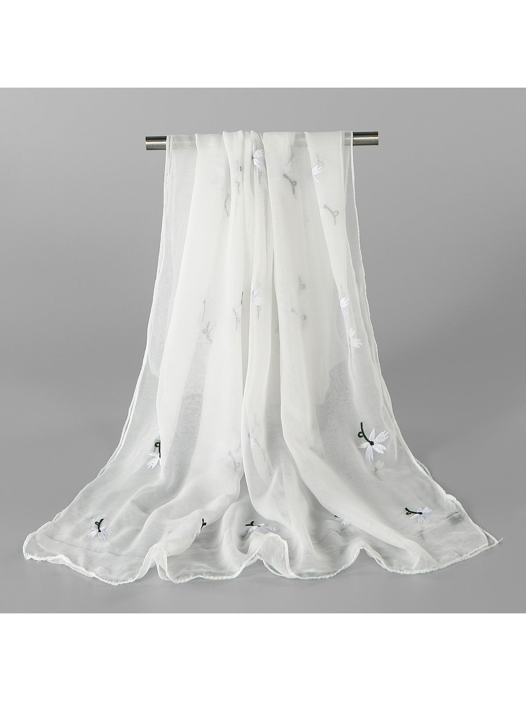 White sheer scarf with scattered white floral embroidery, draped view