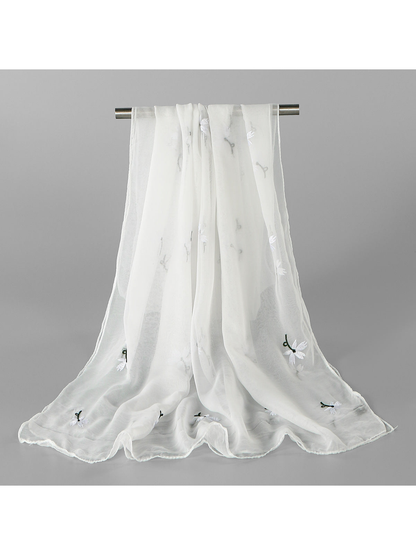 White sheer scarf with scattered white floral embroidery, draped view