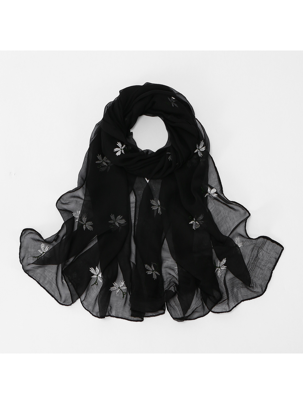 Black sheer floral scarf arranged in a looped styling view
