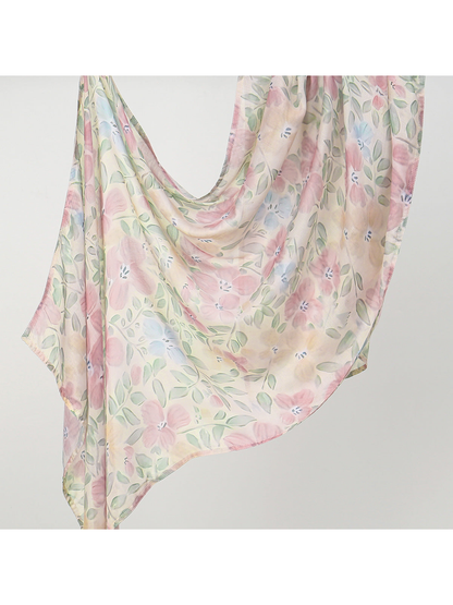 Cream-toned scarf with pink flowers and muted green leaves