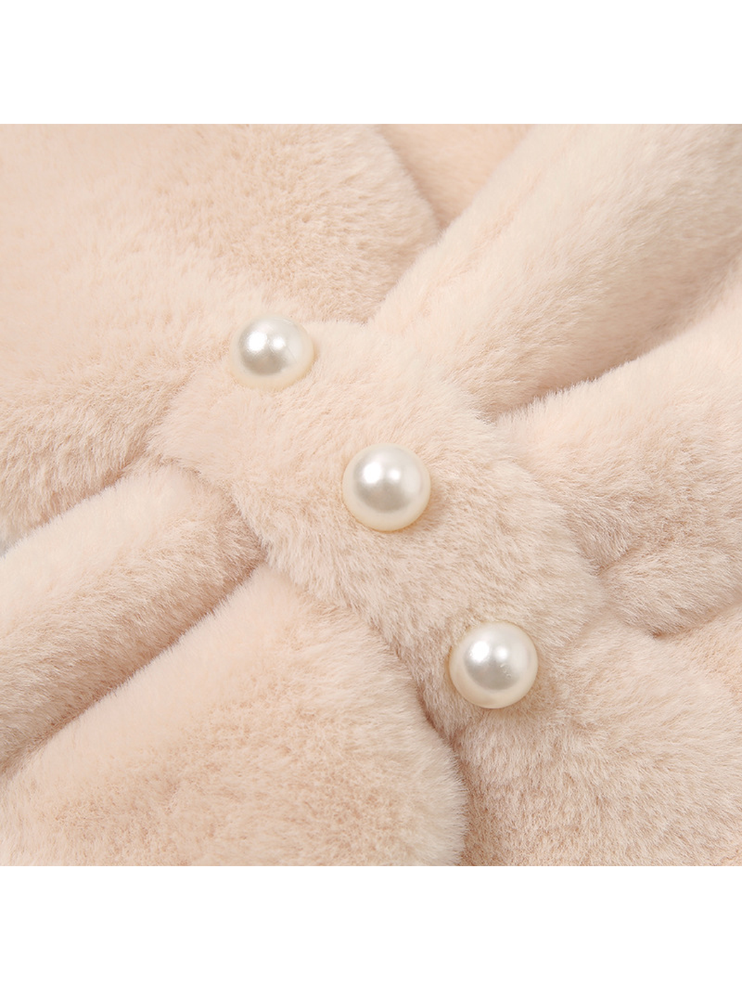 Close-up of the fuzzy texture and three pearl-look studs on the central band