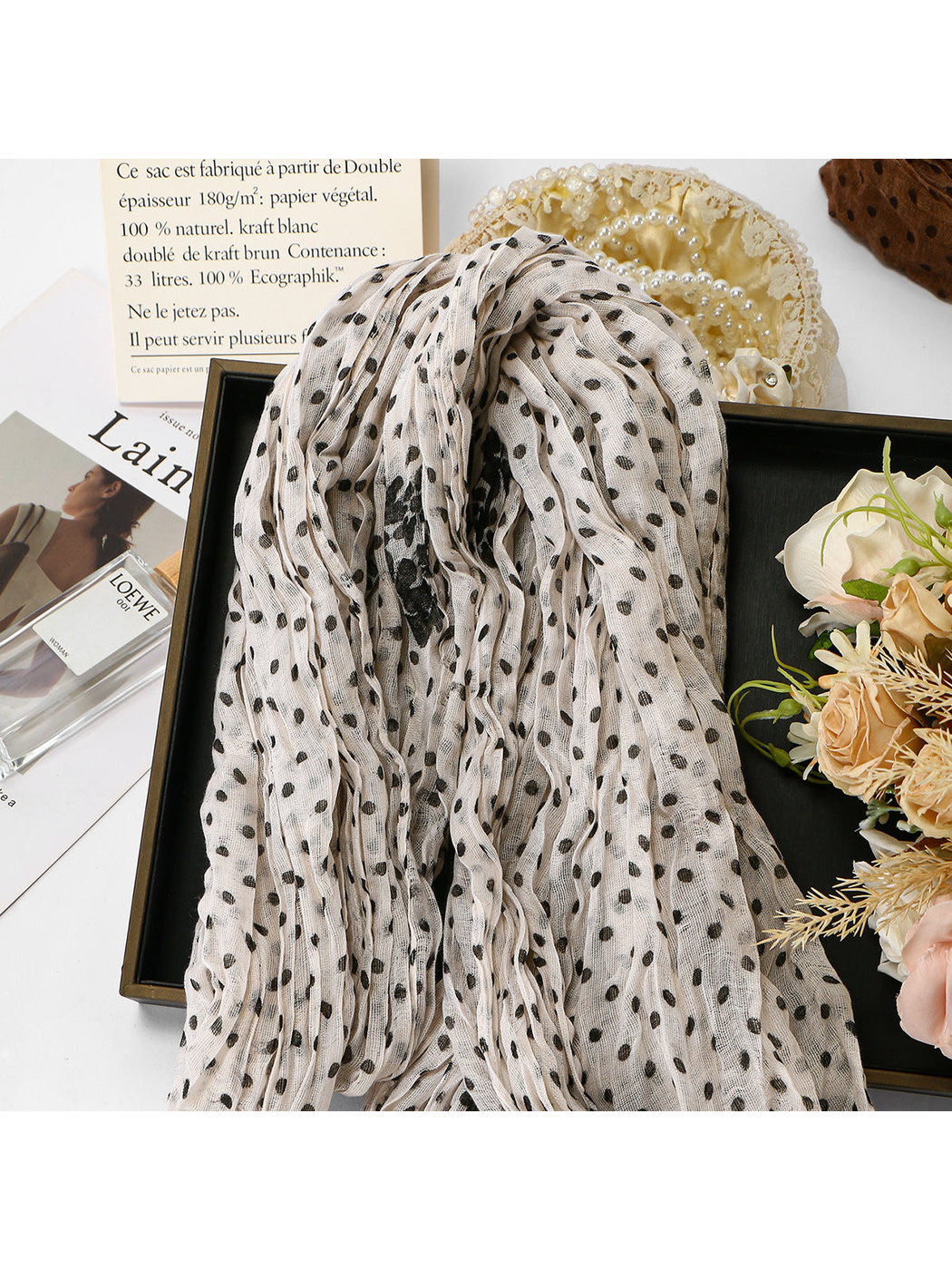 Ivory Dots crinkled scarf draped with floral accents