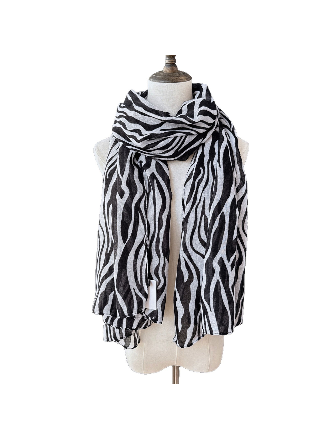 Black animal-stripe scarf wrapped and draped on a dress form