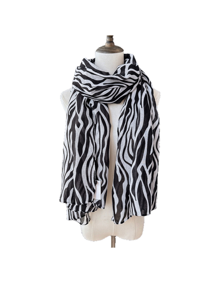 Black animal-stripe scarf wrapped and draped on a dress form