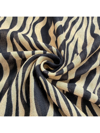 Close-up of the Brown scarf's semi-sheer woven-look texture and animal-stripe pattern