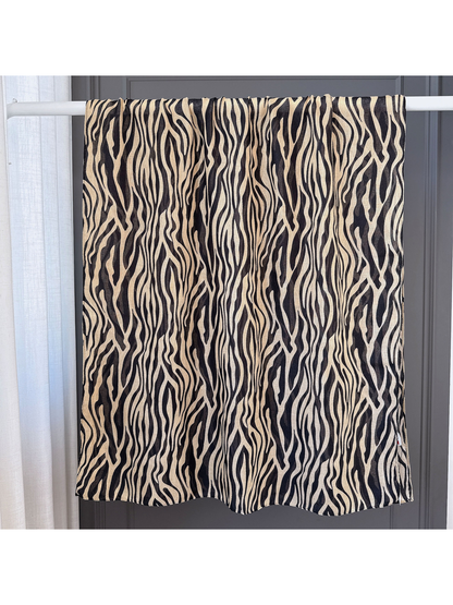 Brown animal-stripe scarf spread open to show its long rectangular shape