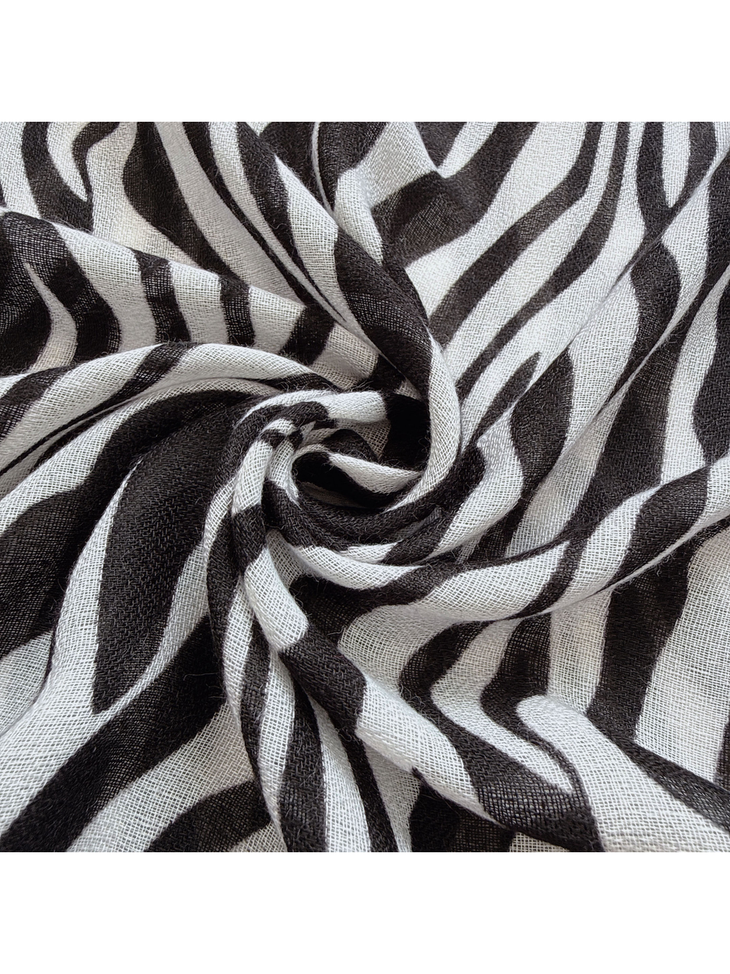 Close-up of the Black scarf's semi-sheer woven-look texture and animal-stripe pattern