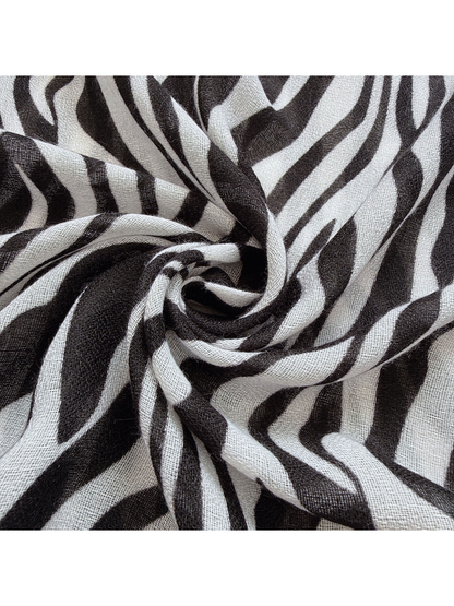 Close-up of the Black scarf's semi-sheer woven-look texture and animal-stripe pattern