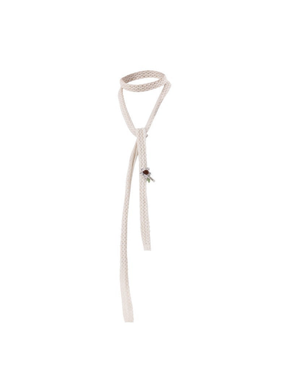 Light neutral skinny scarf with openwork texture and floral appliqué