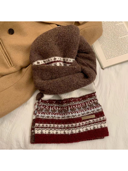 Brown and burgundy geometric-pattern scarf arranged in a knotted flat lay