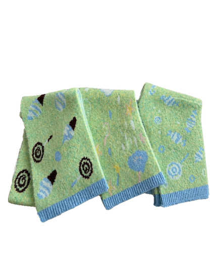 Candy, Ice Cream, and Moon patterned scarves displayed together