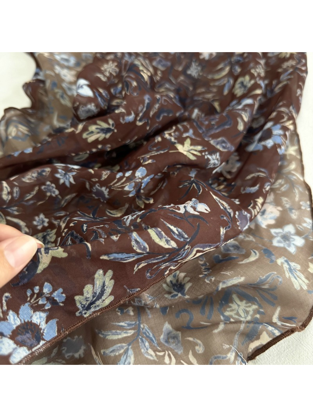 Close-up of the Brown Floral scarf print and finished edge