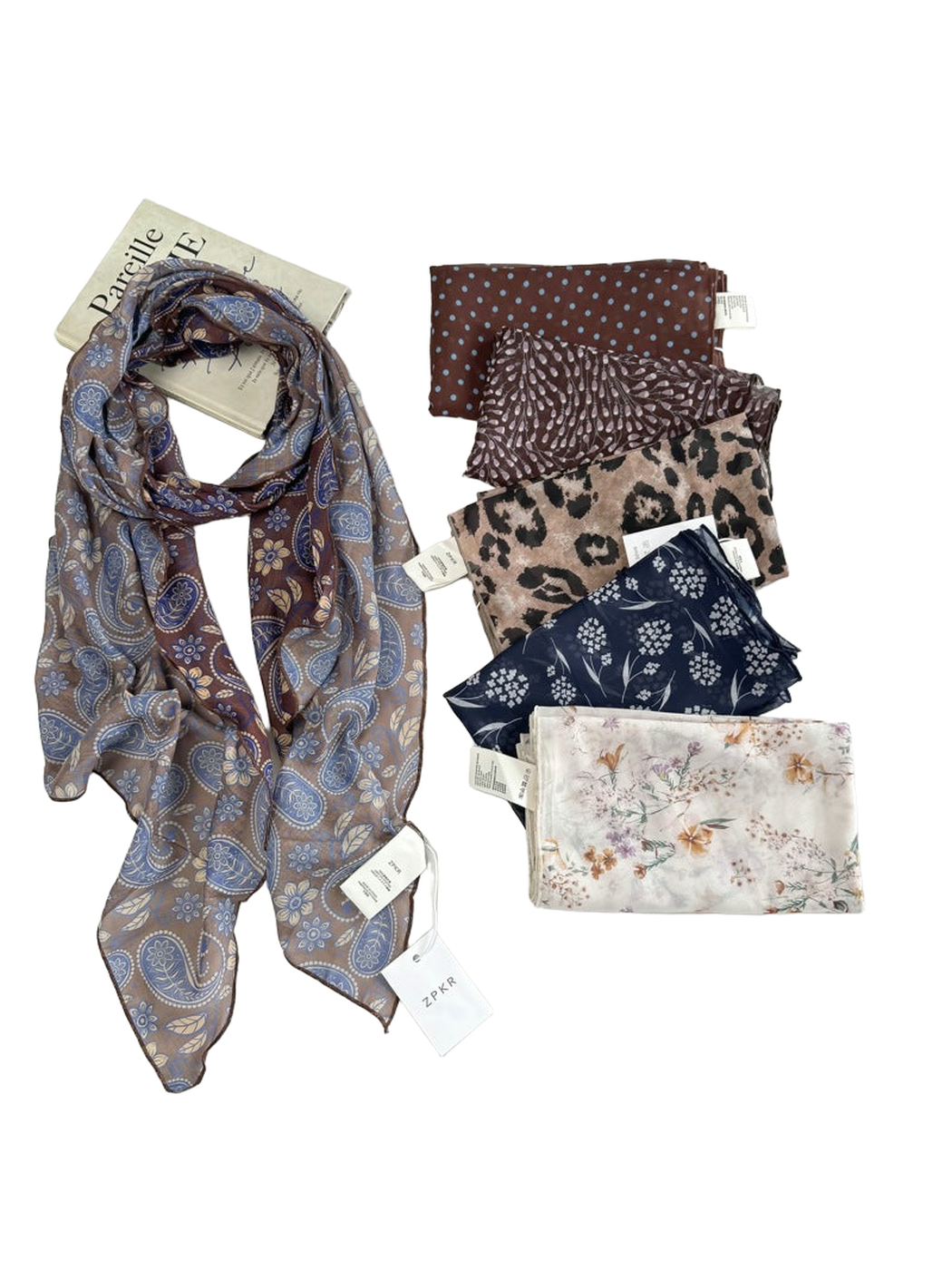 Paisley scarf displayed with five folded patterned styles