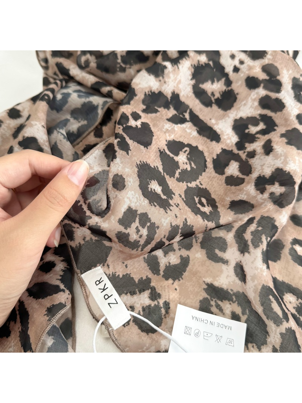 Close-up of the leopard print and semi-sheer surface
