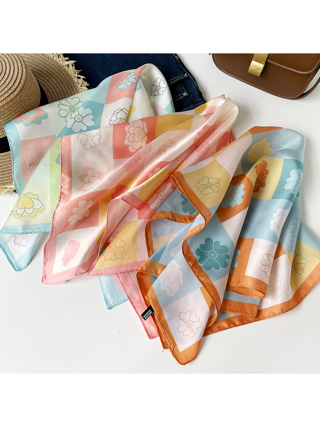 Mint, pink and orange floral checkerboard square scarves draped together