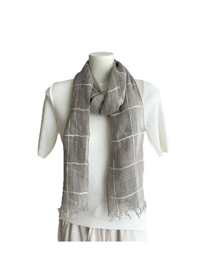 Windowpane scarf with fringed ends styled on a white mannequin