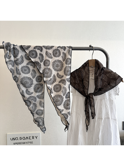 White and brown medallion triangle scarves displayed together