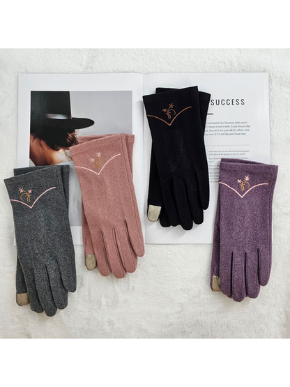 Four glove colors arranged on an open magazine with contrasting fingertip panels visible