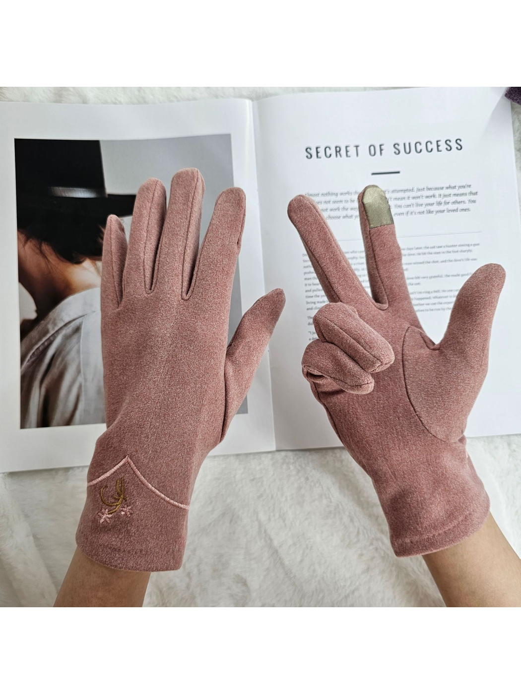 Dusty Pink embroidered gloves worn with one contrasting fingertip panel visible