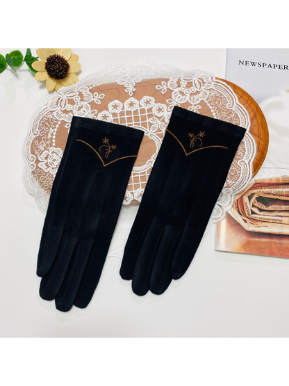 Black gloves with floral embroidery and a contrasting V-shaped cuff line