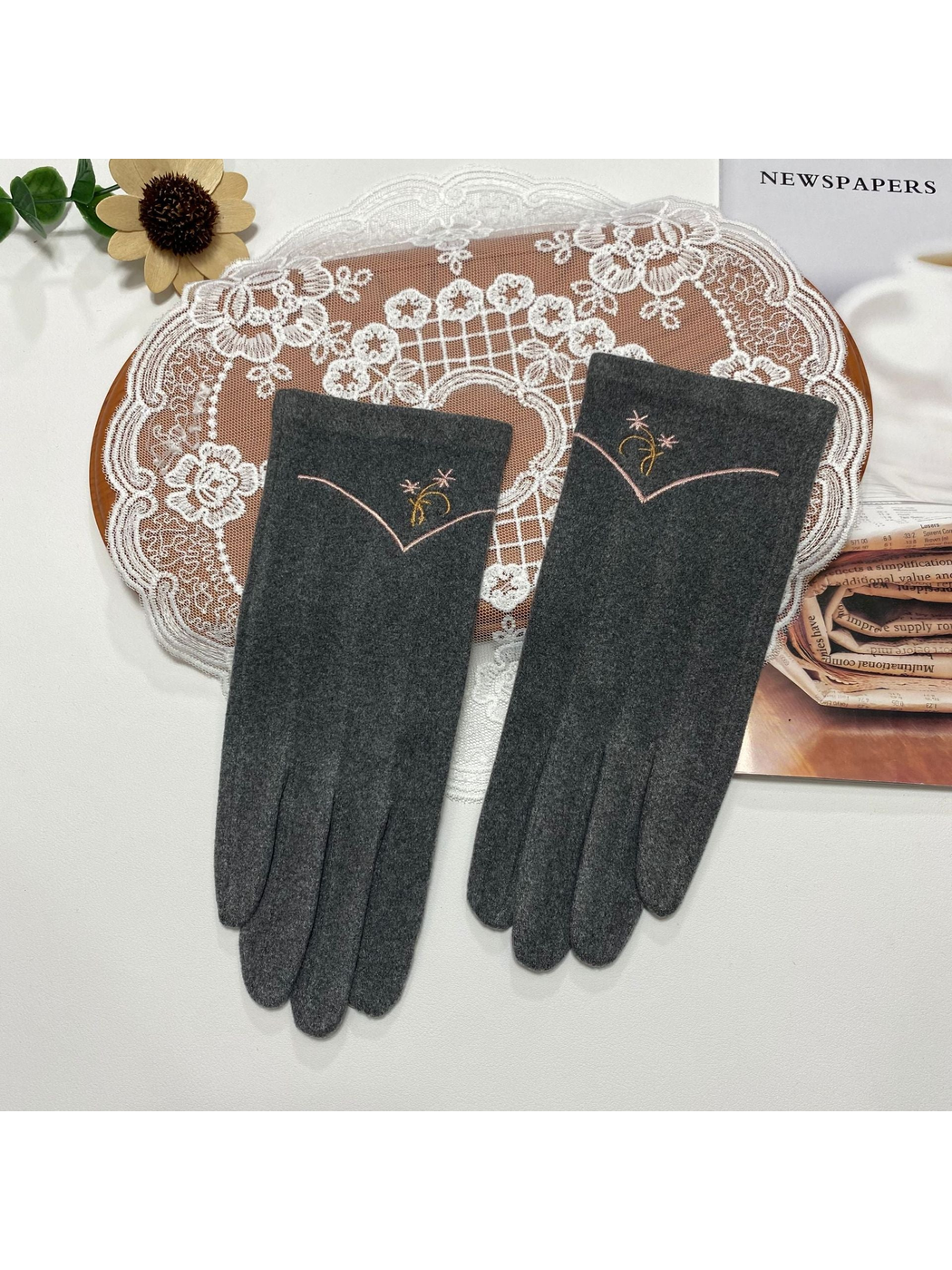 Heather Gray gloves with floral embroidery and a contrasting V-shaped cuff line
