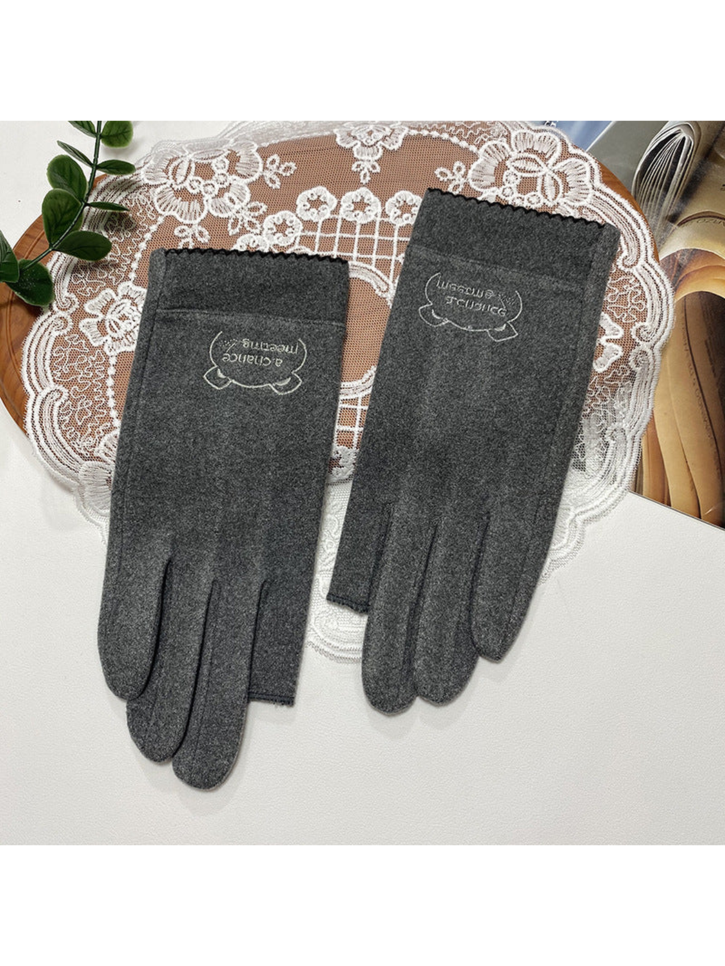 Heather Gray fingerless gloves with a small embroidered cuff emblem