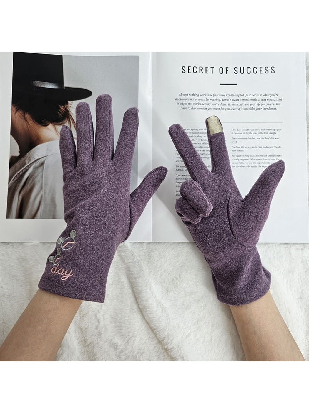 Heather Purple gloves worn to show the palm and embroidered back