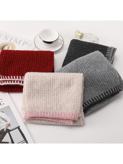 Burgundy, beige, light gray and dark gray scarves folded together