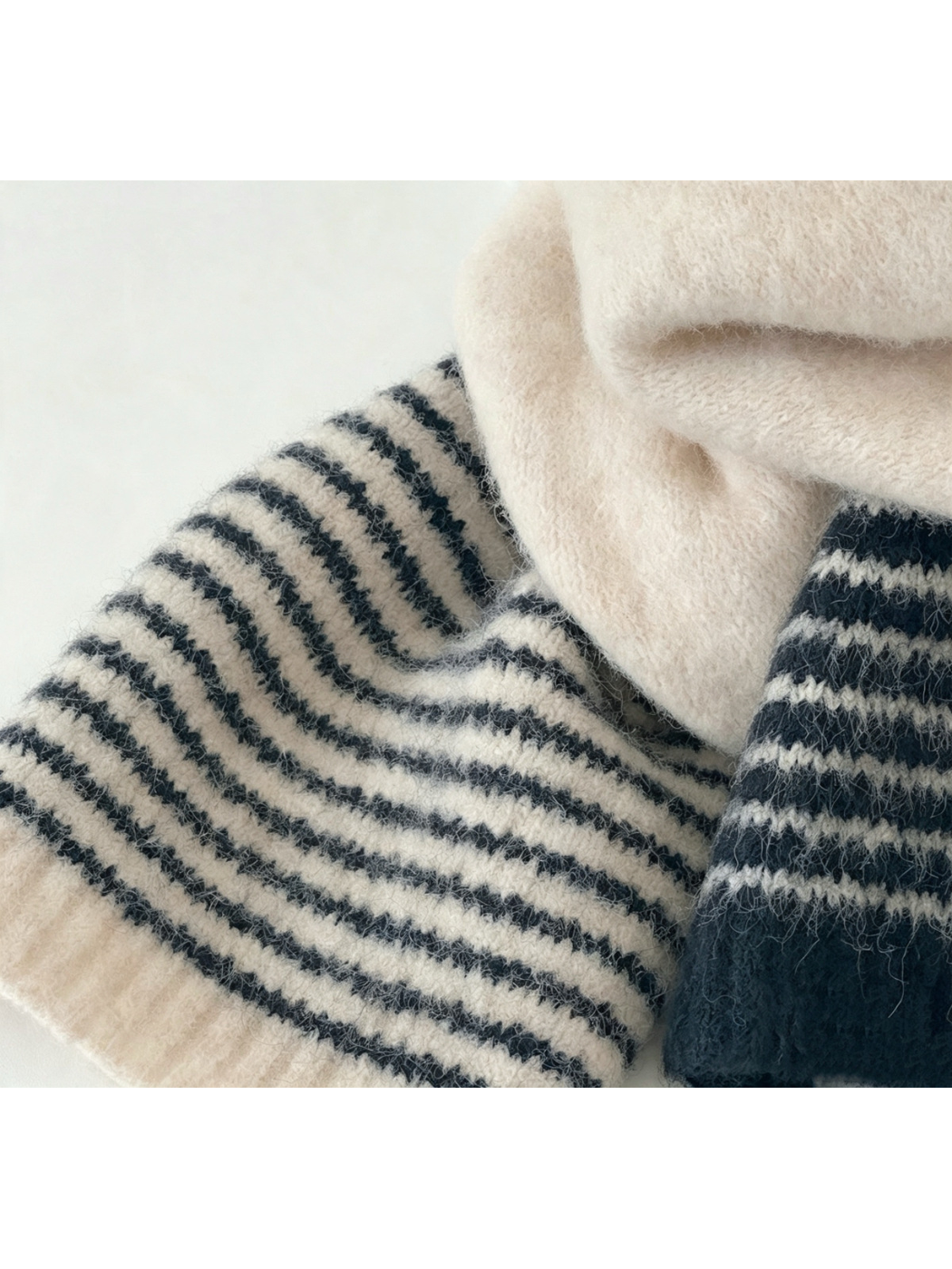 Close-up of the beige and navy striped scarf texture
