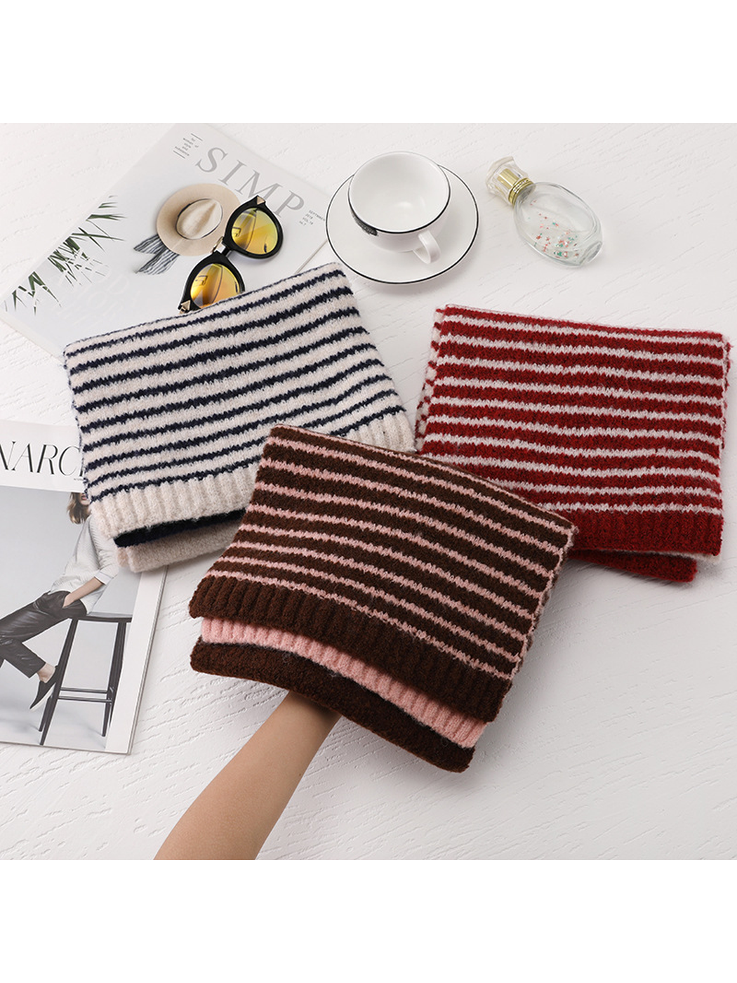 Beige, red and brown striped scarves displayed together